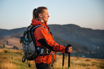 Wall Mural - young woman hiking in the mountains