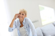 © goodluz - Senior woman talking on mobile phone