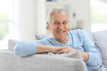 Portrait of smiling senior man with blue shirt