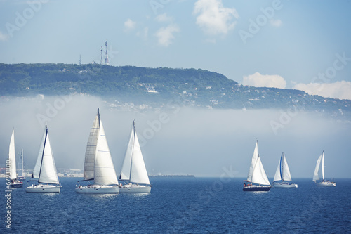 Naklejka ścienna Sailing ship yachts with white sails