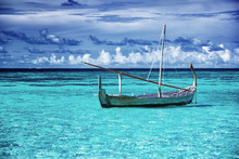 Little Fishing Boat In Blue Sea