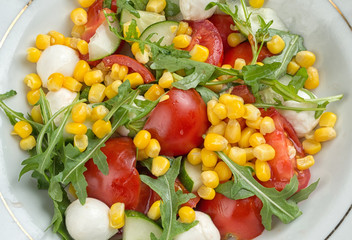 Wall Mural - salad with corn, tomato, arugula and mozzarella cheese