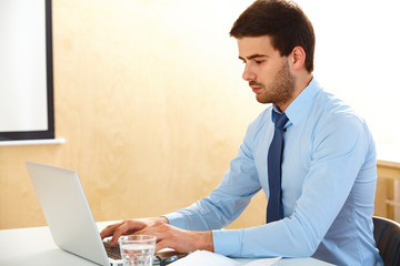 businessman with laptop working in office