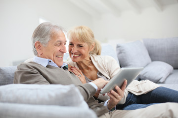 Poster - Cheerful senior people websurfing on internet with tablet