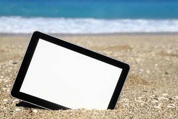 Wall Mural - Tablet computer on the beach