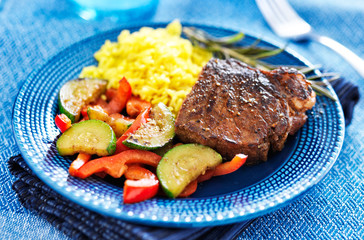 steak with vegetables and rice dinner