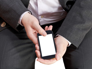 Wall Mural - above view of mobile phone in businessman hand