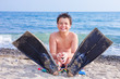 Happy young diver on the sea beach