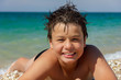 Happy young diver on the sea beach