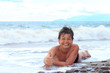 Happy young boy on the sea beach OK