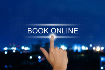 hand pushing book online button on touch screen