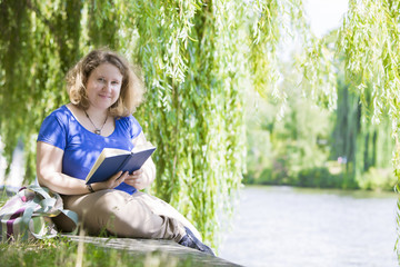 young woman reading a book