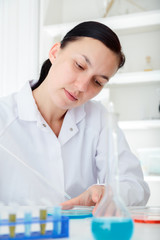 Wall Mural - laboratory assistant analyzing a sample