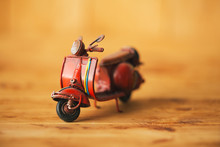 Close-up Of Miniature Hand Made Toy Motorcycle On Rustic Wood