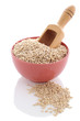 Grain in bowl and wooden scoop