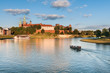The boat on Vistula River near Wawel Royal Castle in Krakow