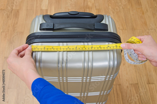 Fotografie, Obraz Hand luggage measurement using measuring tape.