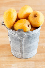 loquat fruit in bucket