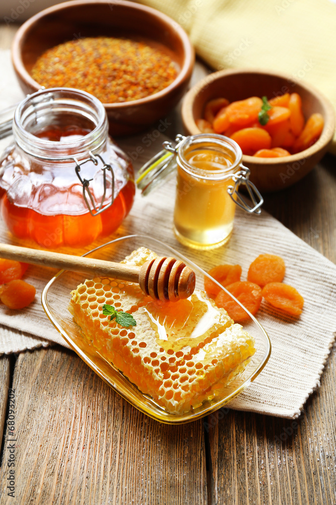 Fresh honey on wooden table