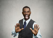 Angry executive gesturing with hands to stop, grey background 