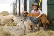 © michaeljung - female horse stables owner and dogs