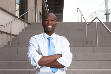 African businessman with stairs in the background