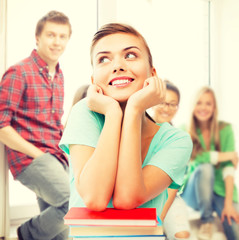 Poster - happy smiling student girl with books at school