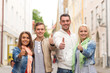 © Syda Productions - group of smiling friends showing thumbs up