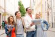 © Syda Productions - group of smiling friends with city guide and map