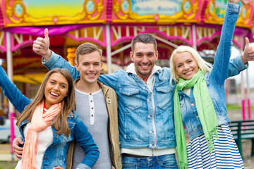 Canvas Print - group of smiling friends showing thumbs up