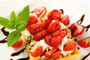 Wall Mural - Crisp waffle with  strawberries and cream