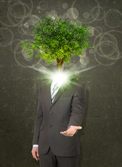 Wall Mural - Businessman stand with green tree instead his head