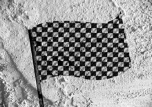 Checkered Flag  On Cement Wall Texture Background Design
