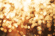 © olesyaturchuk - Glitter festive christmas lights background. light and gold