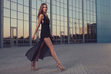 Walking Woman In Long Black Dress