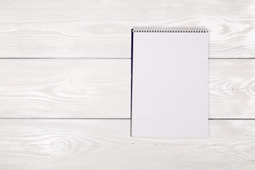 Wall Mural - Notebook on white wood