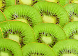 Fototapeta Tęcza - Many slices of kiwi fruit