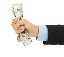 businessman's hand grasping a handful of dollars