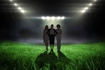 Poster - Composite image of team of businesswomen looking at camera
