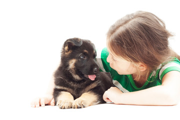 Wall Mural - little girl talking with a puppy