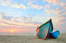 Blue Fishing Boat At Sunrise