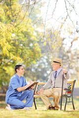 Poster - Healthcare professional checking an senior in park