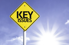 Key Issues Road Sign With Sun Background