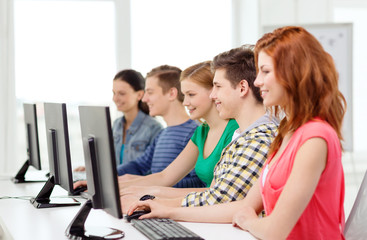 Wall Mural - female student with classmates in computer class