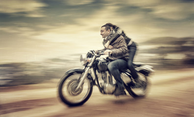 Fototapete - Riding on motorcycle