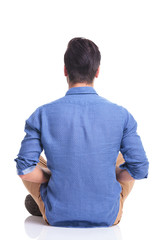 back veiw of a seated young brunette man