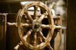 Yachting. Ship wooden steering wheel. Sailboat detail.