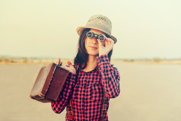 Wall Mural - Tourist woman with binoculars