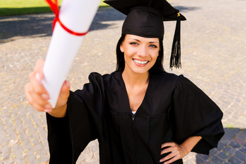 Sticker - Happy graduate with diploma.