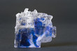 Rock salt/halite with blue inclusion, Sicily, Italy. 4cm across